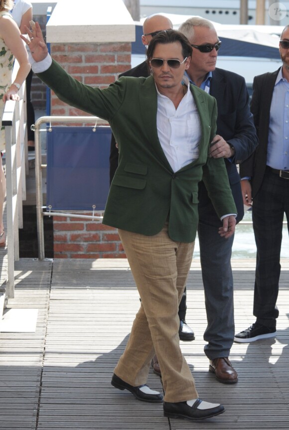 Johnny Depp, Scott Cooper et Dakota Johnson au 72e festival international du film de Venise , la Mostra, le 4 septembre 2015