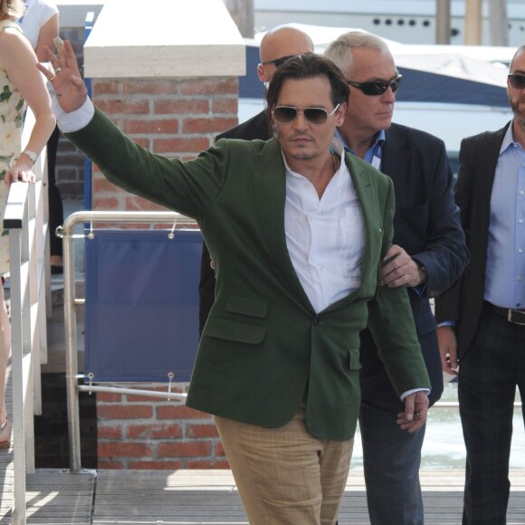 Johnny Depp, Scott Cooper et Dakota Johnson au 72e festival international du film de Venise , la Mostra, le 4 septembre 2015