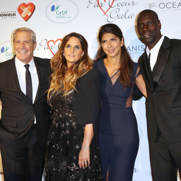 Jean-Claude Darmon, Hélène Sy, Hoda Roche et Omar Sy lors du "Par Coeur Gala" pour les 10 ans de l'association "Cekedubonheur" au pavillon d'Armenonville à Paris le 24 septembre 2015