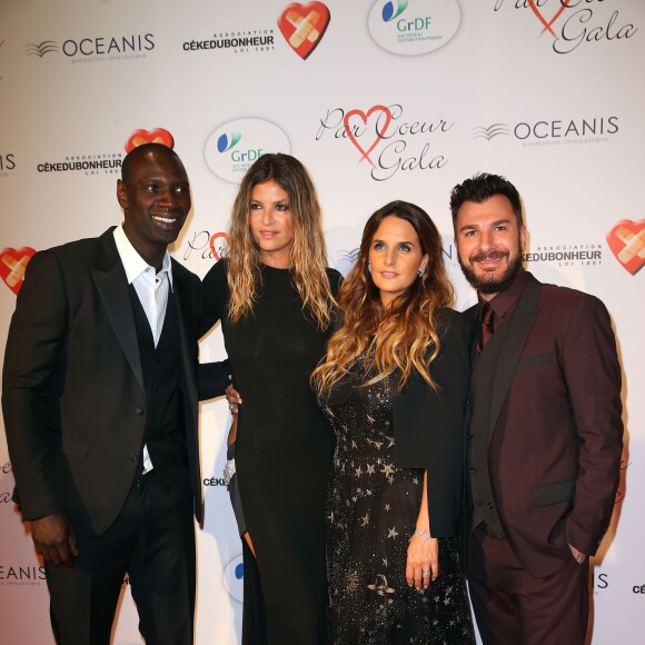 Omar Sy, Isabelle Funaro, Hélène Sy et Michaël Youn lors du "Par Coeur Gala" pour les 10 ans de l'association "Cekedubonheur" au pavillon d'Armenonville à Paris le 24 septembre 2015