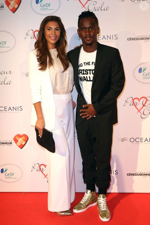 Black M (Alpha Diallo) et sa femme Lia lors du "Par Coeur Gala" pour les 10 ans de l'association "Cekedubonheur" au pavillon d'Armenonville à Paris le 24 septembre 2015
