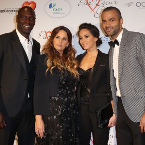 Omar Sy et sa femme Hélène, Tony Parker et sa femme Axelle Francine lors du "Par Coeur Gala" pour les 10 ans de l'association "Cekedubonheur" au pavillon d'Armenonville à Paris le 24 septembre 2015