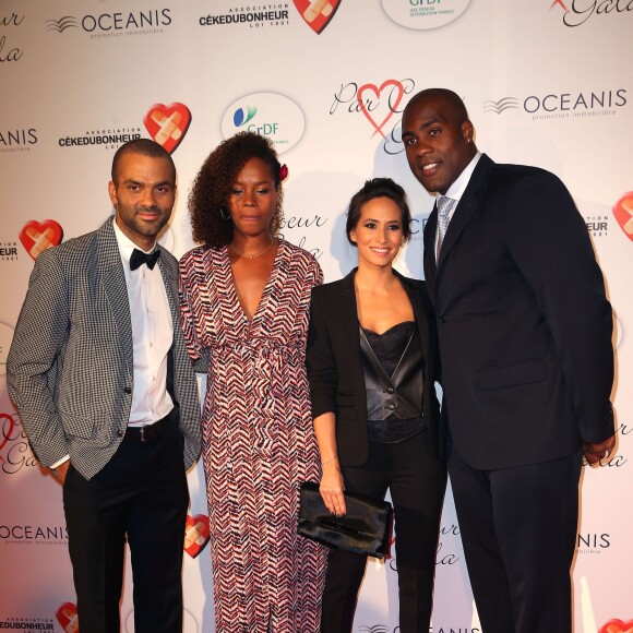 Tony Parker et sa femme Axelle Francine, Teddy Riner et Luthna lors du "Par Coeur Gala" pour les 10 ans de l'association "Cekedubonheur" au pavillon d'Armenonville à Paris le 24 septembre 2015