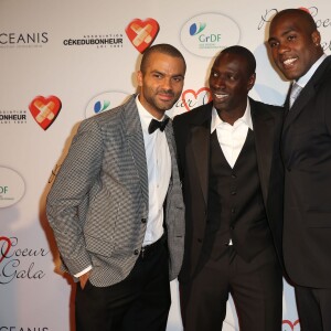 Tony Parker, Omar Sy et Teddy Riner lors du "Par Coeur Gala" pour les 10 ans de l'association "Cekedubonheur" au pavillon d'Armenonville à Paris le 24 septembre 2015