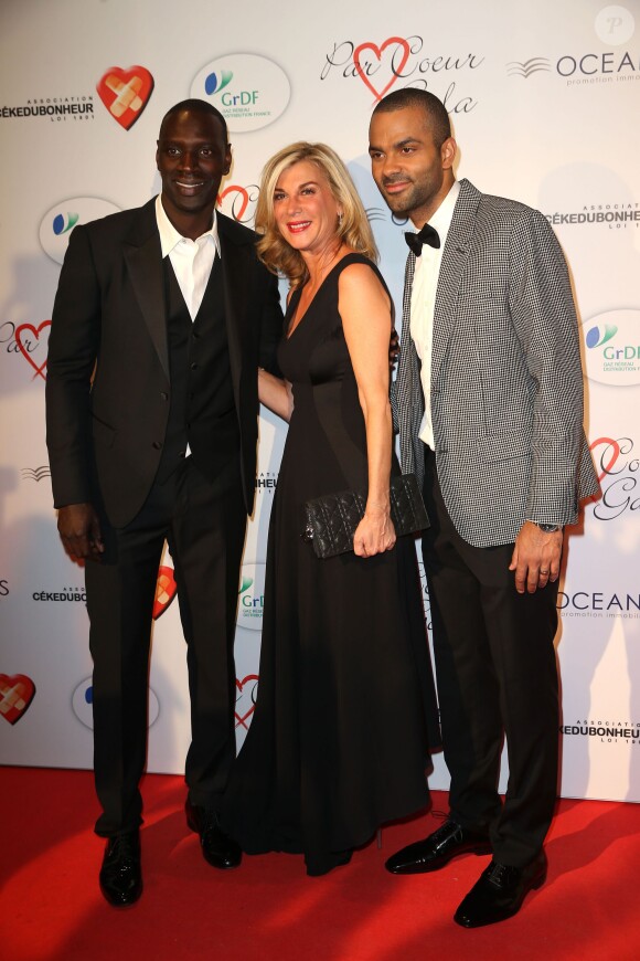 Omar Sy, Michèle Laroque et Tony Parker lors du "Par Coeur Gala" pour les 10 ans de l'association "Cekedubonheur" au pavillon d'Armenonville à Paris le 24 septembre 2015