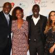 Teddy Riner et sa compagne Luthna, Omar Sy et sa femme Hélène lors du "Par Coeur Gala" pour les 10 ans de l'association "Cekedubonheur" au pavillon d'Armenonville à Paris le 24 septembre 2015