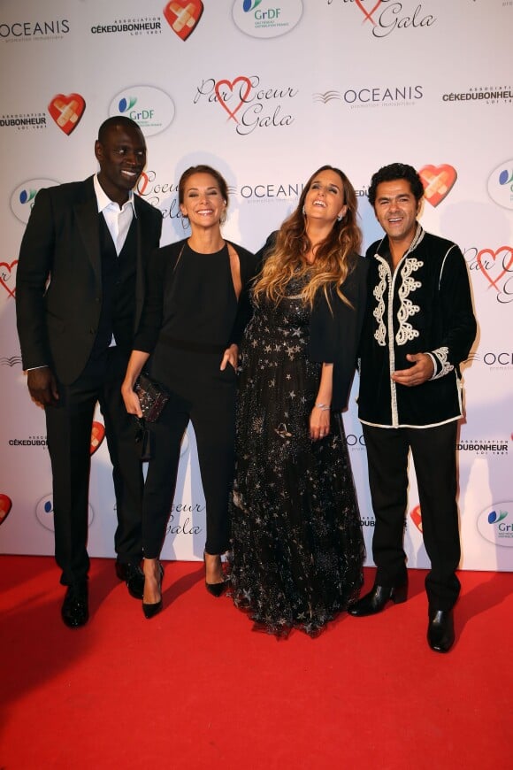 Omar Sy, Mélissa Theuriau, Hélène Sy et Jamel Debbouze lors du "Par Coeur Gala" pour les 10 ans de l'association "Cekedubonheur" au pavillon d'Armenonville à Paris le 24 septembre 2015
