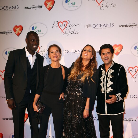 Omar Sy, Mélissa Theuriau, Hélène Sy et Jamel Debbouze lors du "Par Coeur Gala" pour les 10 ans de l'association "Cekedubonheur" au pavillon d'Armenonville à Paris le 24 septembre 2015