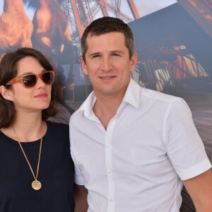 Exclusif - Marion Cotillard et son compagnon Guillaume Canet lors du Longines Paris Eiffel Jumping au Champ-de-Mars à Paris, le 4 juillet 2015.