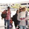 Lance Armstrong, Anna Hansen et leurs enfants Maxwell Edward et Olivia Marie à l'aéroport LAX de Los Angeles, le 4 mai 2014