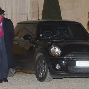 Pierre Nora et Anne Sinclair arrivent au Palais de l'Elysee à Paris le 9 décembre 2013