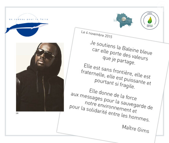Maître Gims - En marge de la COP21 "La baleine bleue" s'installe à Paris et les artistes s'engagent pour soutenir ce projet de l'association "Un cadeau pour la terre" le 30 novembre 2015. Chaque personnalité a signé un engagement de soutient au projet "La baleine bleue".