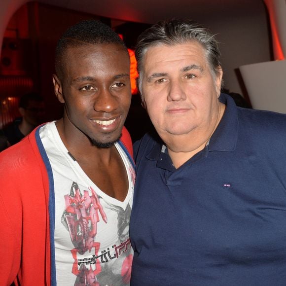 Blaise Matuidi et Pierre Ménès au lancement du jeu vidéo"FIFA 2015 à l'Opéra Garnier Restaurant à Paris le 22 septembre 2014