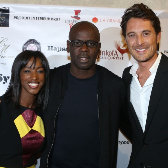 Lilian Thuram entre Hapsatou Sy et son compagnon Vincent Cerutti - - Inauguration du showroom d'Hapsatou Sy au Viaduc des Arts à Paris, le 14 janvier 2016. © CVS/Bestimage