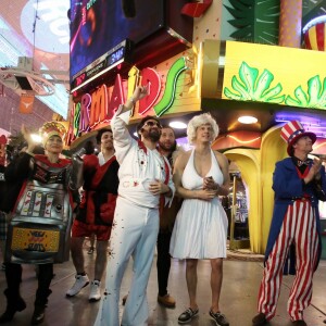 Exclusif - Jour 2 - Cyril Hanouna, Camille Combal et leurs cinq chroniqueurs se promènent sur la Fremont Street Experience à Las Vegas le 1er avril 2016. Moktar Guetari s'est déguisé en indien, Cyril Hanouna en Elvis Presley, Jean-Michel Maire en Oncle Sam, Camille Combal en boxeur, Isabelle Morini-Bosc en machine à sous, Matthieu Delormeau en Marilyn Monroe et Gilles Verdez en catcheur. Cyril Hanouna et son futur époux Camille Combal sont partis à Las Vegas le jeudi 31 mars 2016 pour célébrer leur mariage le samedi 2 avril 2016. Jean-Michel Maire, Isabelle Morini-Bosc, Matthieu Delormeau, Moktar Guetari et Gilles Verdez étaient les cinq chroniqueurs qui les accompagnaient ainsi que des invités de l'émission "Touche pas à mon poste !" choisis dans le public.