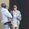 Kim Kardashian et son mari Kanye West sont allés déjeuner avec leur fille North à Malibu. Kanye West pose avec Corey Gamble pour les photographes devant sa voiture et profite pour présenter sa nouvelle collection de vêtements!! Le 14 mai 2016