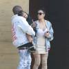 Kim Kardashian et son mari Kanye West sont allés déjeuner avec leur fille North à Malibu. Kanye West pose avec Corey Gamble pour les photographes devant sa voiture et profite pour présenter sa nouvelle collection de vêtements!! Le 14 mai 2016