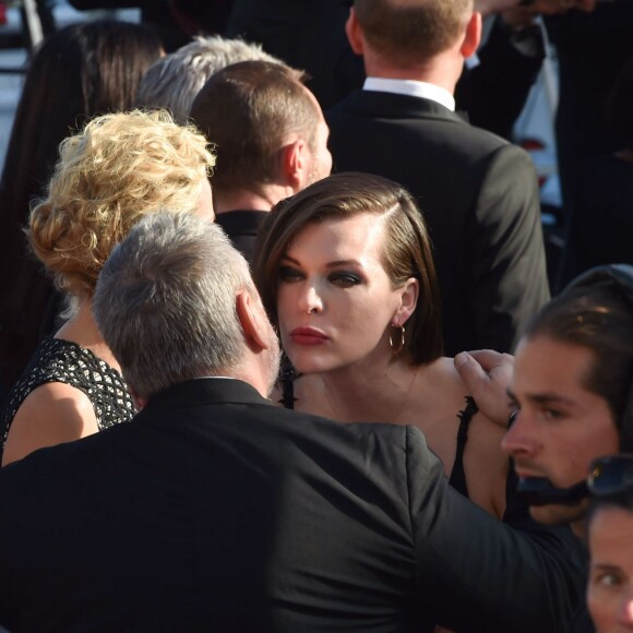 Luc Besson avec sa femme Virginie Silla et son ex-femme Milla Jovovich à la montée des marches du film "The Last Face" lors du 69ème Festival International du Film de Cannes le 20 mai 2016. © Lionel Urman / Bestimage