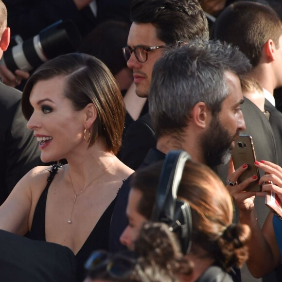 Luc Besson avec sa femme Virginie Silla et son ex-femme Milla Jovovich à la montée des marches du film "The Last Face" lors du 69ème Festival International du Film de Cannes le 20 mai 2016. © Lionel Urman / Bestimage