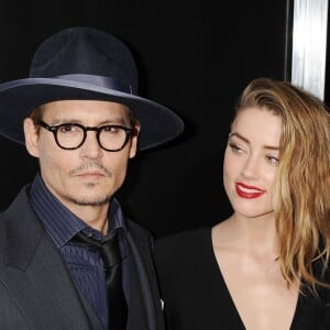 Johnny Depp et sa fiancée Amber Heard - Première du film "3 Days to Kill" à Hollywood, le 12 février 2014.