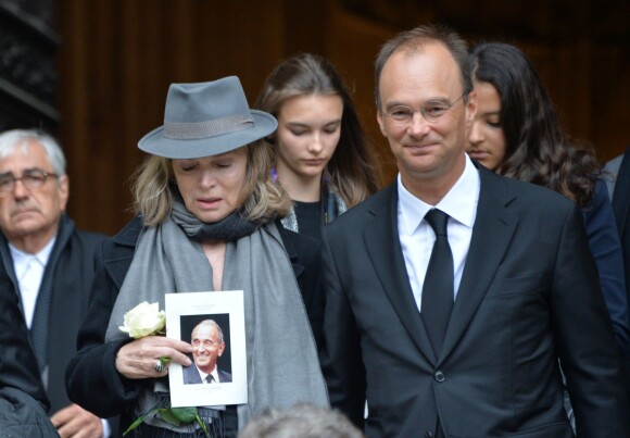 Anouchka Rousselet (la veuve d'André Rousselet) et Nicolas Rousselet à la sortie des obsèques de André Rousselet en la Basilique Sainte-Clotilde de Paris le 2 juin 2016.02/06/2016 - Paris