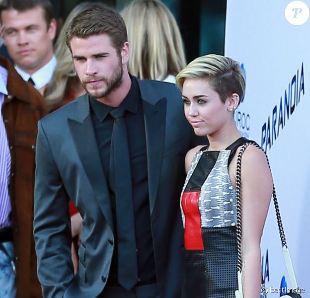 Miley Cyrus et Liam Hemsworth à la première du film "Paranoia" à Los Angeles, le 8 août 2013.