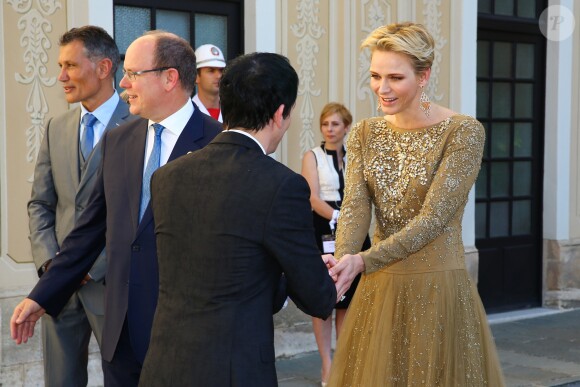 La princesse Charlene et le prince Albert de Monaco accueillant les invités lors du cocktail organisé le 14 juin 2016 dans la cour du palais princier en marge du 56e Festival de Télévision de Monte-Carlo. © Pool Festival TV Monaco / BestImage