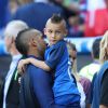 Dimitri Payet avec son fils Noa lors du match des 8ème de finale de l'UEFA Euro 2016 France-Irlande au Stade des Lumières à Lyon, France le 26 juin 2016. © Cyril Moreau/Bestimage