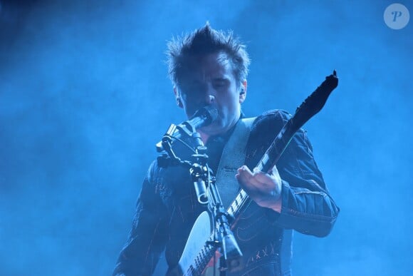 Matthew Bellamy et son groupe Muse en concert dans la Fan Zone de la Tour Eiffel, à Paris, le 28 juin 2016. © Lise Tuillier