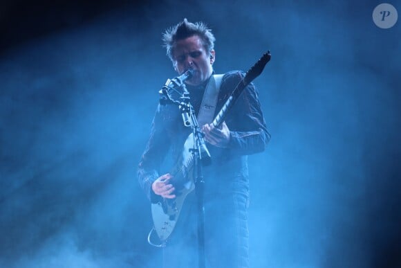 Matthew Bellamy et son groupe Muse en concert dans la Fan Zone de la Tour Eiffel, à Paris, le 28 juin 2016. © Lise Tuillier