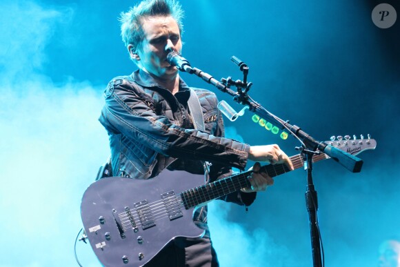 Matthew Bellamy et son groupe Muse en concert dans la Fan Zone de la Tour Eiffel, à Paris, le 28 juin 2016. © Lise Tuillier