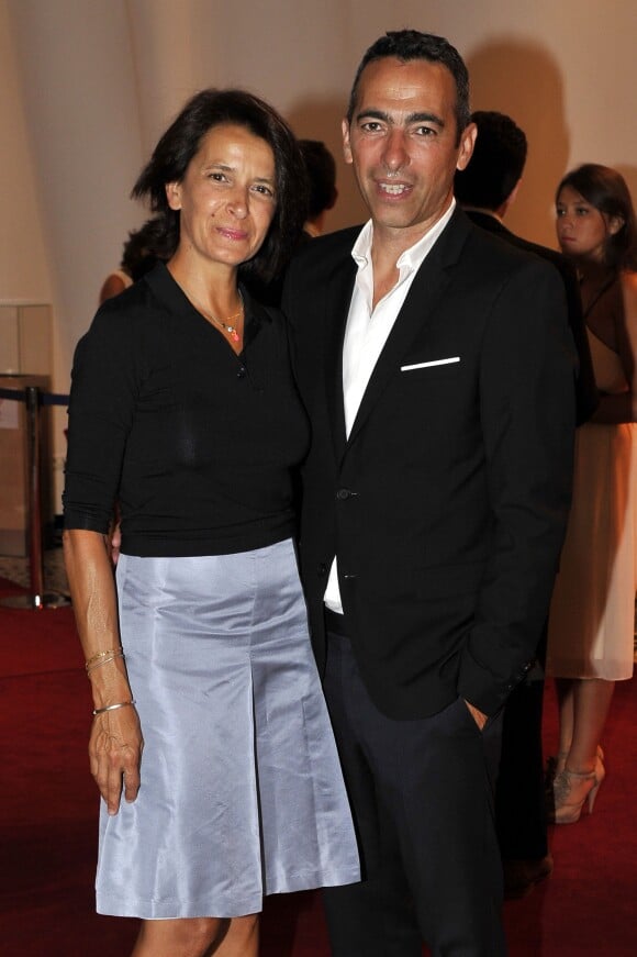 L'ancien footballeur Youri Djorkaeff et sa femme Sophie Djorkaeff lors du traditionnel gala au profit de l'association Fight Aids Monaco à Mont-Carlo, Monaco, le 10 Juillet 2015.