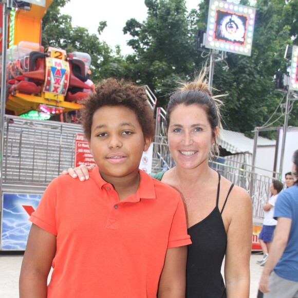 Sandrine Diouf et son fils Isaac - Inauguration de la Fête des Tuileries à Paris le 26 juin 2015.