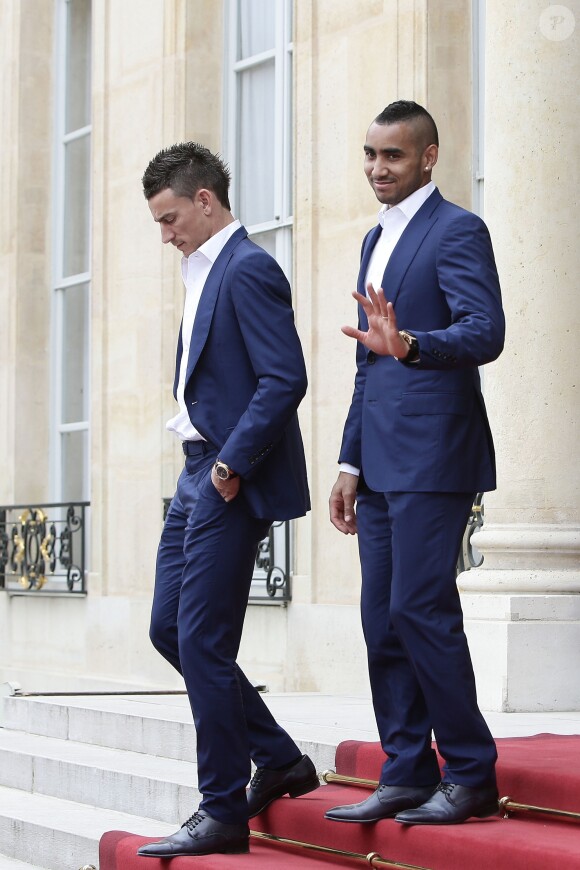 Laurent Koscielny et Dimitri Payet - L'équipe de France de football quitte le palais de l'Elysée après avoir été reçue par François Hollande pour un déjeuner à Paris, le 11 juillet 2016 après leur défaite en finale de la coupe de l'UEFA Euro 2016.