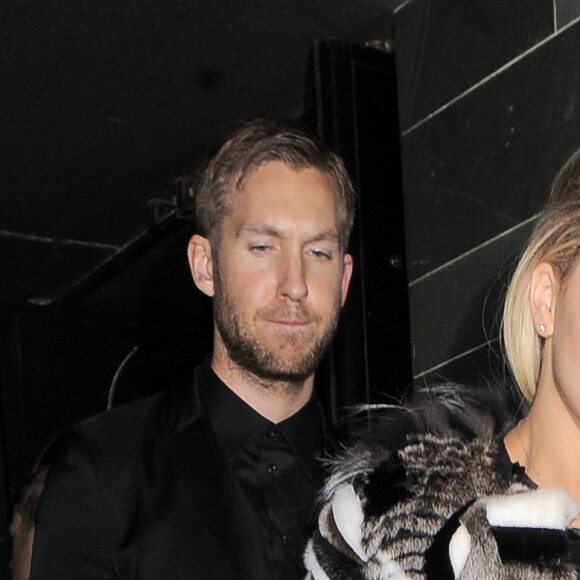 Rita Ora et son petit-ami Calvin Harris à la sortie de l'After-Party au restaurant Hakkasan après la soirée des Brit Awards à Londres, le 19 février 2014.