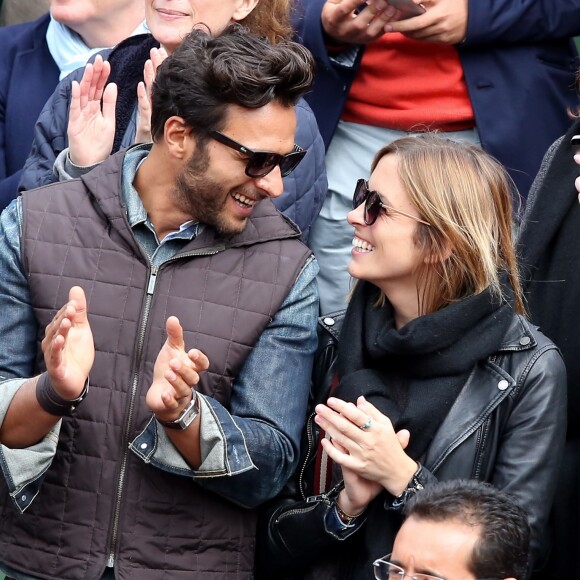 Maxim Nucci (Yodelice) et sa compagne Isabelle Ithurburu dans les tribunes des Internationaux de France de tennis de Roland-Garros à Paris. Le 24 mai 2016 © Dominique Jacovides / Bestimage