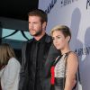 Liam Hemsworth et Miley Cyrus à la Premiere du film "Paranoia" a Los Angeles, le 8 aout 2013.