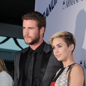 Liam Hemsworth et Miley Cyrus à la Premiere du film "Paranoia" a Los Angeles, le 8 aout 2013.