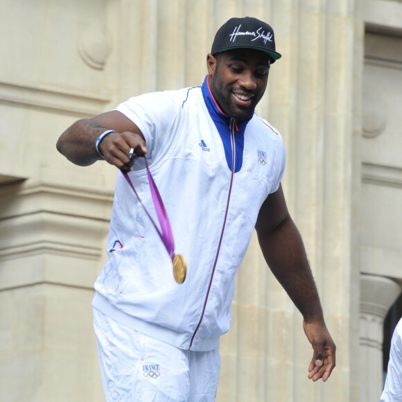 Teddy Riner et l'équipe de France olympique à son retour des Jeux de Londres - Sur les Champs-Elysées à Paris, le 13 août 2012.