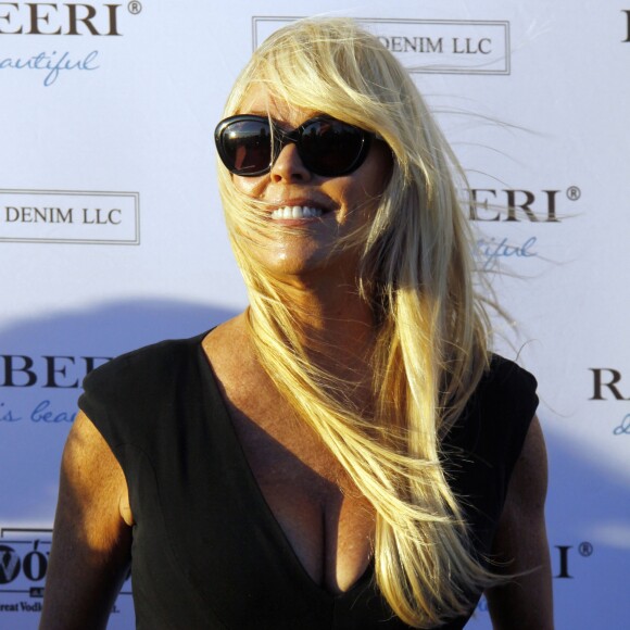 Dina Lohan à la Soirée "Ranbeeri Denim" (marque dont Ali Lohan est l'égérie) au rooftop Jimmy du James Hotel à New York, le 4 août 2015.