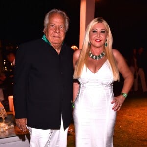 Massimo Gargia et Monika Bacardi lors de la soirée d'anniversaire "Fawaz's Folies" pour les 64 ans de Fawaz Gruosi (de Grisogono) à la Cala di Volpe à Porto-Cervo, Sardaigne, Italie, le 8 août 2016. © Agence/Bestimage