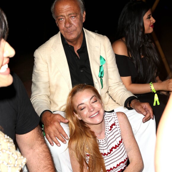 Fawaz Gruosi et Lindsay Lohan lors de la soirée d'anniversaire "Fawaz's Folies" pour les 64 ans de Fawaz Gruosi (de Grisogono) à la Cala di Volpe à Porto-Cervo, Sardaigne, Italie, le 8 août 2016. © Agence/Bestimage