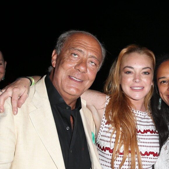 Fawaz Gruosi, Lindsay Lohan et Isabel dos Santos lors de la soirée d'anniversaire "Fawaz's Folies" pour les 64 ans de Fawaz Gruosi (de Grisogono) à la Cala di Volpe à Porto-Cervo, Sardaigne, Italie, le 8 août 2016. © Agence/Bestimage Celebs during the Fawaz Gruosi 64 years "Fawaz’s Folies" birthday party at Cala di Volpe à Porto-Cervo, Sardinia, Italy, on August 8th, 2016.08/08/2016 - Porto Cervo