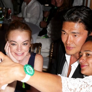 Lindsay Lohan, Rick Yune et Isabel dos Santos lors de la soirée d'anniversaire "Fawaz's Folies" pour les 64 ans de Fawaz Gruosi (de Grisogono) à la Cala di Volpe à Porto-Cervo, Sardaigne, Italie, le 8 août 2016. © Agence/Bestimage Celebs during the Fawaz Gruosi 64 years "Fawaz’s Folies" birthday party at Cala di Volpe à Porto-Cervo, Sardinia, Italy, on August 8th, 2016.08/08/2016 - Porto Cervo