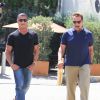Exclusif - Arnold Schwarzenegger et Sylvester Stallone vont déjeuner ensemble au restaurant Ebaldi à Beverly Hills, le 29 août 2016. A la sortie du restaurant, Arnold a fumé un cigare avant de monter à bord de sa Bugatti.