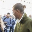 Le chanteur Stromae, les cheveux longs, et sa femme Coralie Barbier quittent leur hôtel pour se rendre au défilé de mode "Louis Vuitton" collection prêt-à-porter printemps-été 2017 lors de la Fashion Week, place Vendôme à Paris, France, le 5 octobre 2016. © Agence/Bestimage