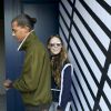 Le chanteur Stromae, les cheveux longs, et sa femme Coralie Barbier quittent leur hôtel pour se rendre au défilé de mode "Louis Vuitton" collection prêt-à-porter printemps-été 2017 lors de la Fashion Week, place Vendôme à Paris, France, le 5 octobre 2016. © Agence/Bestimage