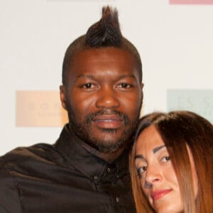 Djibril Cissé et sa compagne Marie-Cécile Lenzini assistent à la 4 ème édition du Marrakech du Rire le 14 juin 2014.