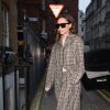 Exclusive - Victoria Beckham is seen make-up free and wearing head-to-toe plaid as she steps out shopping in London, England, UK. Victoria popped into Connolly's and was buying socks - presumably for her husband David - while out and about. The outfit was believed to be from her Pre-Fall 2017 collection, accessorised with some nailhead heels. The fashion conscious star looked to have taken fashion inspiration form the much mocked 90's style (pioneered by celebs such as Daniella Westbrook) of wearing head-to-toe plaid. London, UK, December 16, 2016. Photo by ABACAPRESS.COM19/12/2016 - London