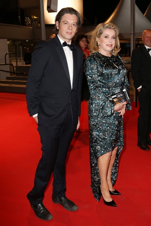 Benjamin Biolay et Catherine Deneuve - Descente des marches du film "L'homme qu'on aimait trop" lors du 67 ème Festival du film de Cannes – Cannes le 21 mai 2014.